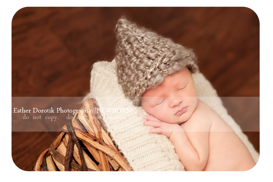 newborn-boy-laying-in-wood-bowl-with-knit-hat-taken-by-Dallas-photographer